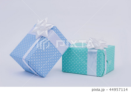 Gift boxes with bow on light background. Gift boxes with bow on light background. 44957114