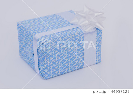 Blue gift box with white satin ribbon. Blue gift box with white satin ribbon. 44957125