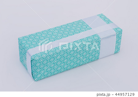 Gift box wrapped in beautiful turquoise paper. Gift box wrapped in beautiful turquoise paper. 44957129