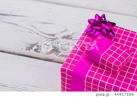 Beautiful present box on wooden background. Beautiful present box on wooden background. 44957169