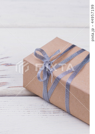 Gift box wrapped in craft paper. Gift box wrapped in craft paper. 44957199