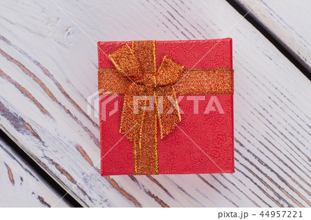Red jewelry gift box on wooden background. 44957221