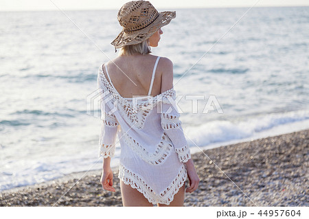 Portrait of fashionable women on the beach of the sea coast Portrait of fashionable women on the beach of the sea coast 44957604