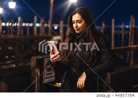 Beautiful young woman taking selfie in the city 44957704