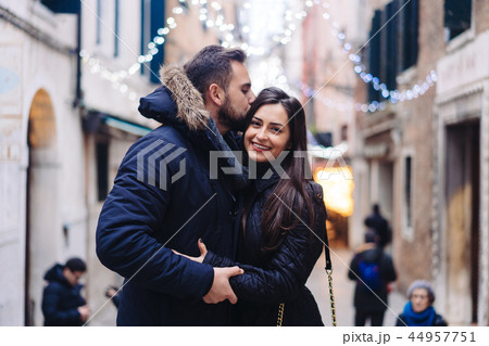 Guy and attractive girl are standing together on street. Guy and attractive girl are standing together on street. 44957751