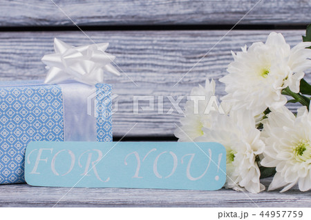 Romantic background with gift and flowers. Romantic background with gift and flowers. 44957759