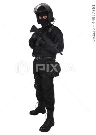 SWAT officer with assault rifle in black uniform SWAT officer with assault rifle in black uniform 44957861