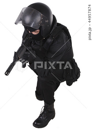 SWAT officer with assault rifle in black uniform 44957874
