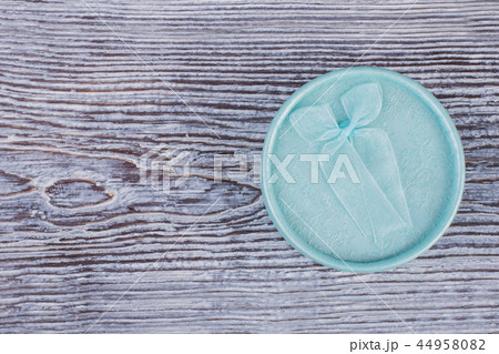 Modern jewelry gift box on wooden background. 44958082