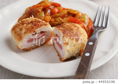 Schnitzel Cordon bleu with vegetables 44958196