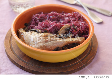 Roasted duck leg with mushrooms and red cabbage 44958219