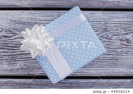 Gift box with white satin ribbon. 44958224