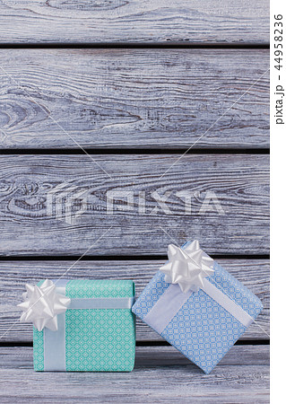 Gift boxes on vintage wooden background. Gift boxes on vintage wooden background. 44958236