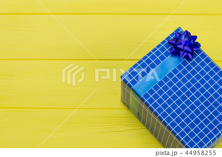 Blue checkered gift box and copy space. Blue checkered gift box and copy space. 44958255