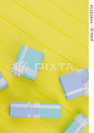 Present boxes on yellow background. Present boxes on yellow background. 44958256