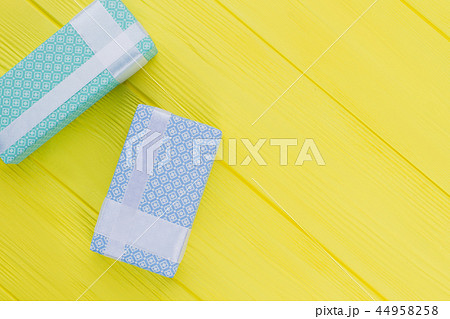 Gift boxes with beautiful design on yellow background. Gift boxes with beautiful design on yellow background. 44958258