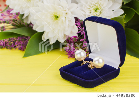 Close up pearl earrings in blue velvet box. Close up pearl earrings in blue velvet box. 44958280