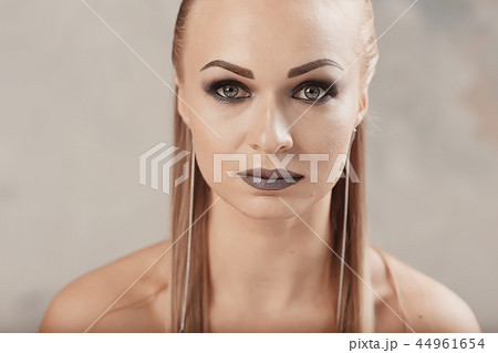 professional make-up model studio / model posing in studio with bright fresh make-up, beautiful eyes and lips with makeup 44961654
