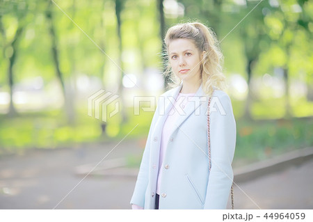 summer girl outdoor air / cheerful adult girl model on a summer walk in the city park, happiness, pleasure freedom 44964059