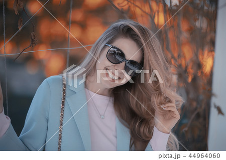 autumn girl / portrait of a girl in an autumn city park, walk happy weekend female portrait autumn girl / portrait of a girl in an autumn city park, walk happy weekend female portrait 44964060