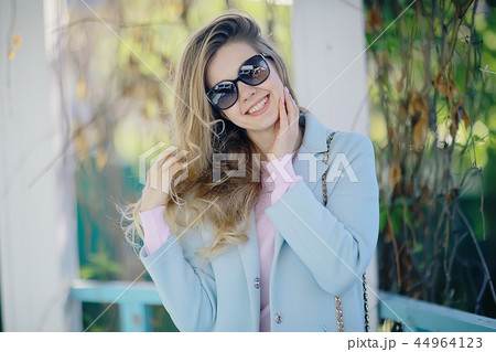 summer girl outdoor air / cheerful adult girl model on a summer walk in the city park, happiness, pleasure freedom 44964123