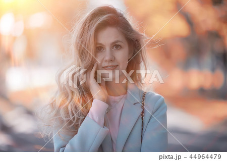 walk in autumn park / beautiful girl in autumn park, model female happiness and fun in yellow trees October 44964479