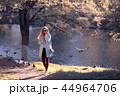 shore pond park adult girl / walk in city park, beautiful girl near pond in urban outdoor recreation area 44964706