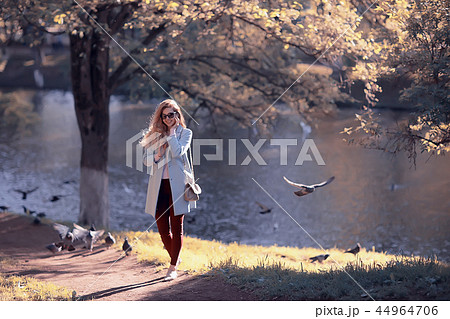 shore pond park adult girl / walk in city park, beautiful girl near pond in urban outdoor recreation area shore pond park adult girl / walk in city park, beautiful girl near pond in urban outdoor recreation area 44964706