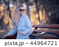 walk in autumn park / beautiful girl in autumn park, model female happiness and fun in yellow trees October 44964721