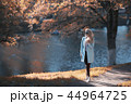 shore pond park adult girl / walk in city park, beautiful girl near pond in urban outdoor recreation area 44964725