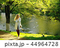 summer girl outdoor air / cheerful adult girl model on a summer walk in the city park, happiness, pleasure freedom 44964728
