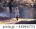 shore pond park adult girl / walk in city park, beautiful girl near pond in urban outdoor recreation area 44964733
