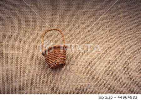 Wicker basket on a basket background Wicker basket on a basket background 44964983