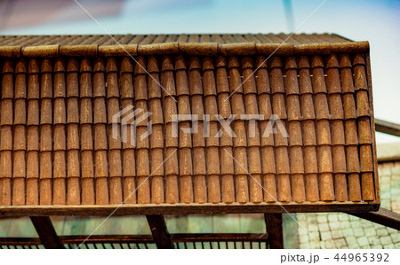 Traditional roof icovered with tiles made of wood Traditional roof icovered with tiles made of wood 44965392