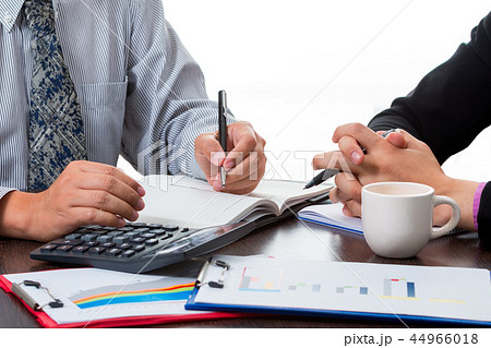 Two business men discussing the market share data Two business men discussing the market share data 44966018