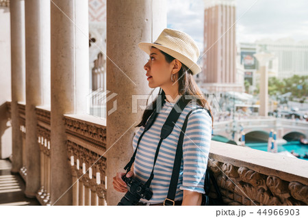 tourist standing in the corridor and relaxing tourist standing in the corridor and relaxing 44966903