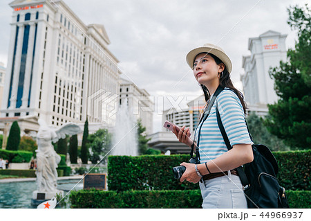 traveler walking through the fountain traveler walking through the fountain 44966937