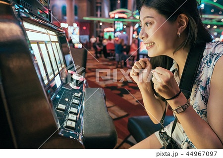 Asian gambling in casino playing slot machines Asian gambling in casino playing slot machines 44967097