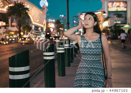 chinese lady with dress walking flicks hair chinese lady with dress walking flicks hair 44967103