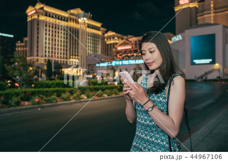 girl texting sms on mobile phone app girl texting sms on mobile phone app 44967106