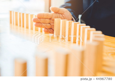 Businessman plan and strategy in business Domino Businessman plan and strategy in business Domino 44967780