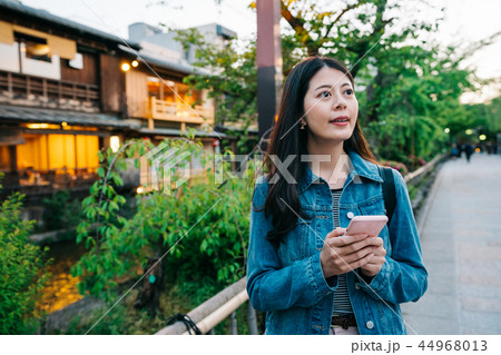 a modern lady seeing at the sunset a modern lady seeing at the sunset 44968013