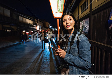 tourist waiting for local friend to have dinner tourist waiting for local friend to have dinner 44968016