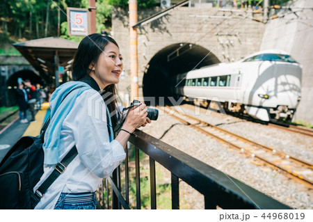photographer watching the train drive out tunnel photographer watching the train drive out tunnel 44968019