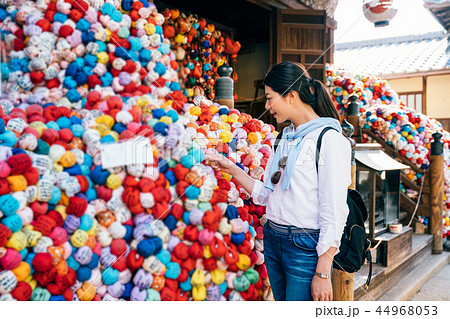 pretty traveler reading letter on colorful dolls 44968053