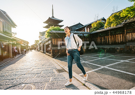 female traveler standing on the road 44968178