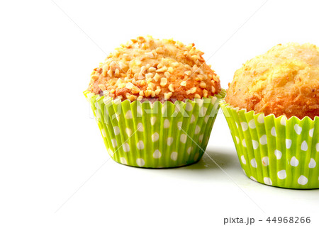 Assorted with Delicious homemade cupcakes with raisins and chocolate isolated on white background Assorted with Delicious homemade cupcakes with raisins and chocolate isolated on white background 44968266