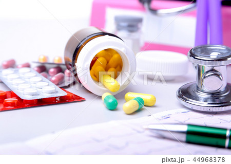 Close-up stethoscope lying on RX prescription with assorted pills. Healthy life or insurance concept 44968378