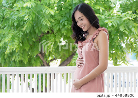 woman has a pregnancy baby inside. woman has a pregnancy baby inside. 44969900