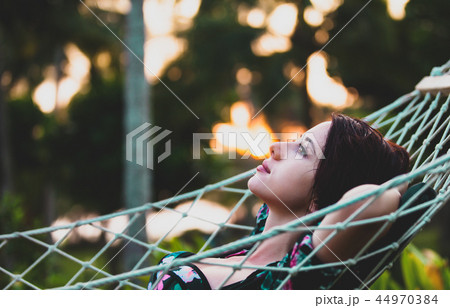 woman relaxing in a hammock woman relaxing in a hammock 44970384